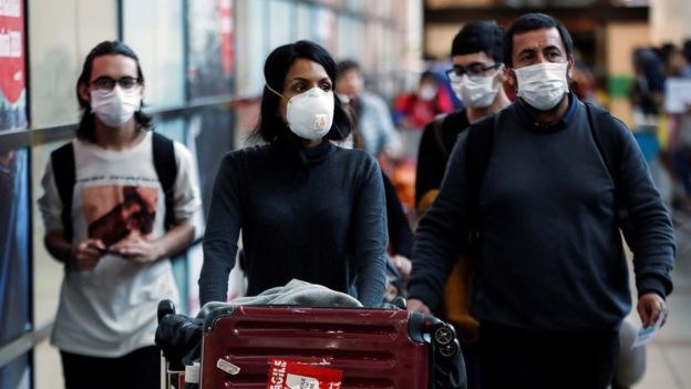 Passengers at an airport in Santiago